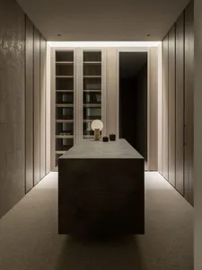 Contemporary minimalist room with wooden furniture and geometric rug.
