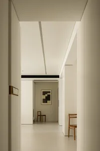 A minimalist interior with white walls and floors.