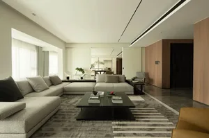 A modern minimalist living room with clean lines, a white and grey color palette, and a combination of wooden, marble, and gl
