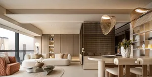 A modern living room featuring neutral-toned furniture, open layout, and large windows with city skyline view.