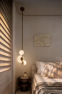 A minimalist bedroom featuring a bed with textured fabric cover and a hanging light fixture.
