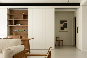 A minimalist home interior with wooden elements and a clean, modern design.