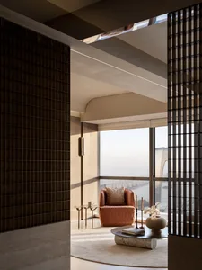 Modern living room with high ceiling, featuring contemporary furniture and cityscape view.