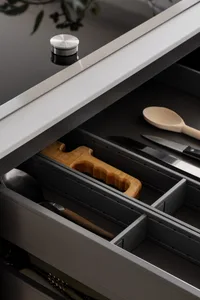 Modern kitchen storage solutions featuring metal and wooden elements.