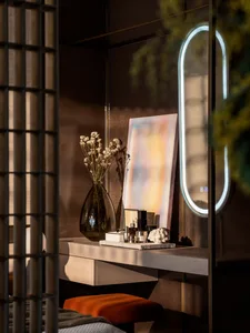 A stylish, modern vanity desk with a wooden top.