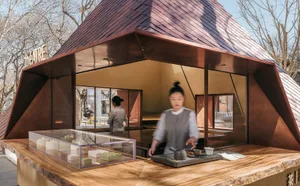 A modern food court concept with a wooden counter displaying pastries.