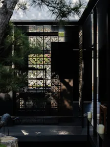 The image showcases a modern interior with black metal decor.