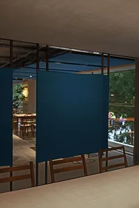 Modern minimalist interior design featuring a blue canvas curtain.