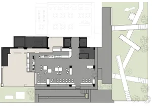 Modern office space with a concrete floor and open layout.