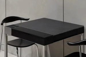 A sleek, modern metal desk in black.