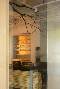 Modern coffee shop interior with wooden tables and metal chairs