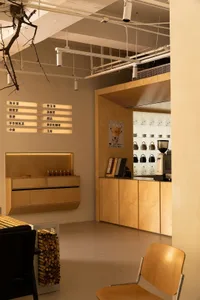 A cozy coffee shop interior with wooden furniture and decor.