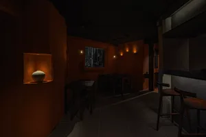 Industrial-style restaurant interior with concrete walls and ambient lighting