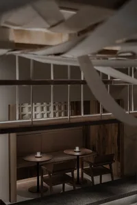 Modern cafe interior featuring wood and concrete elements