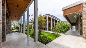 Modern residential space featuring concrete and timber materials.
