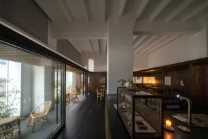 Modern interior design featuring wood and concrete in a cafe-bar setting