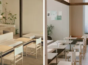 Minimalist restaurant interior with wooden chairs and beige walls