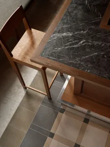 Marble countertop with wood frame in a commercial setting.