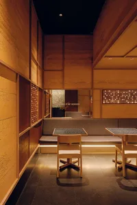 Modern restaurant interior with concrete walls and floors