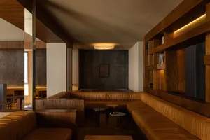 Modern loft space with leather seating and wooden accents.