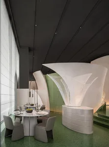 A modern minimalist restaurant interior with white marble accents and seating.