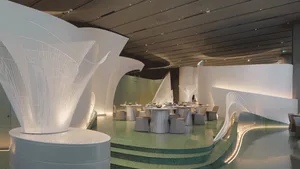 Modern restaurant with concrete walls and illuminated lighting features