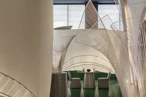 Modern restaurant interior with a tented metal frame design