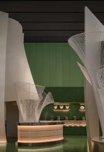 Modern retail store interior featuring concrete and glass elements.