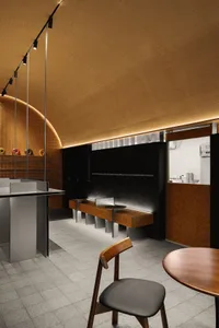 Minimalist design featuring wooden elements in a modern coffee shop interior
