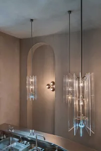 Modern kitchen with hanging glass pendant lights.