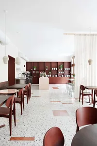 Interior design of a modern coffee shop featuring terrazzo flooring.