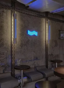 Concrete bar with barstools and neon lighting