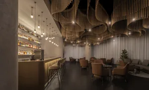 Modern industrial lounge bar with wooden decor and hanging lights