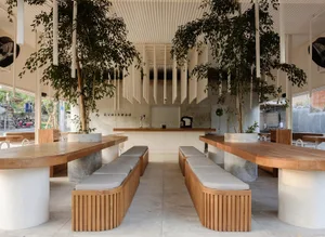 Modern interior design of a coffee shop with concrete and steel elements.