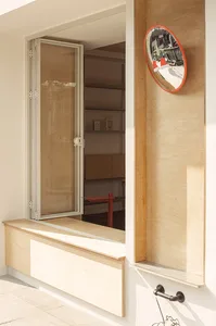 Modern storefront with wooden accents and concrete base