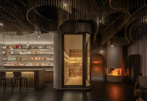 Contemporary bar interior with modern concrete finishes and minimalist design.