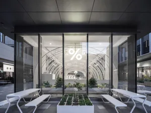 Modern cafe interior with glass walls and minimalist design