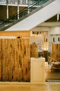 A restaurant interior with bamboo walls and furniture