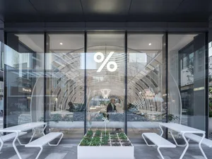 Modern retail entryway featuring glass doors and minimalist interior design.