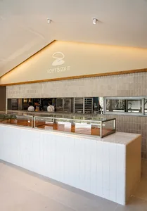 Modern restaurant interior with a tiled and concrete counter