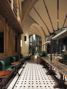 An industrial-style cafe interior featuring marble and concrete materials.