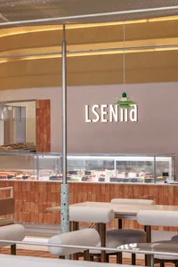 Modern cafe interior with terrazzo flooring and minimalist design