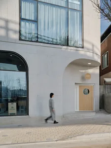 Modern storefront with a concrete exterior and glass windows and door