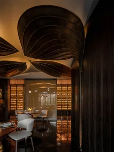 Modern restaurant interior with wooden ceiling design