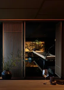 A modern minimalist residential interior with wooden elements.