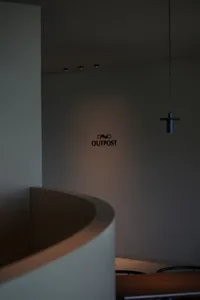 A cozy coffee shop with a black blend theme, featuring modern furniture and ambient lighting.