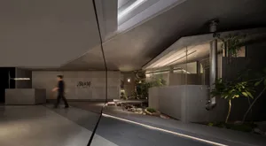 Concrete walls and floor in a modern office setting with a natural plant.