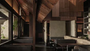 Interior of a restaurant featuring wood and concrete materials