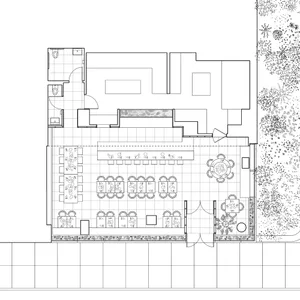 Black and white architectural plan of a restaurant facility, showcasing the layout and design of the space.