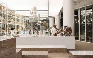 A minimalist coffee shop with stone, glass, and metal elements